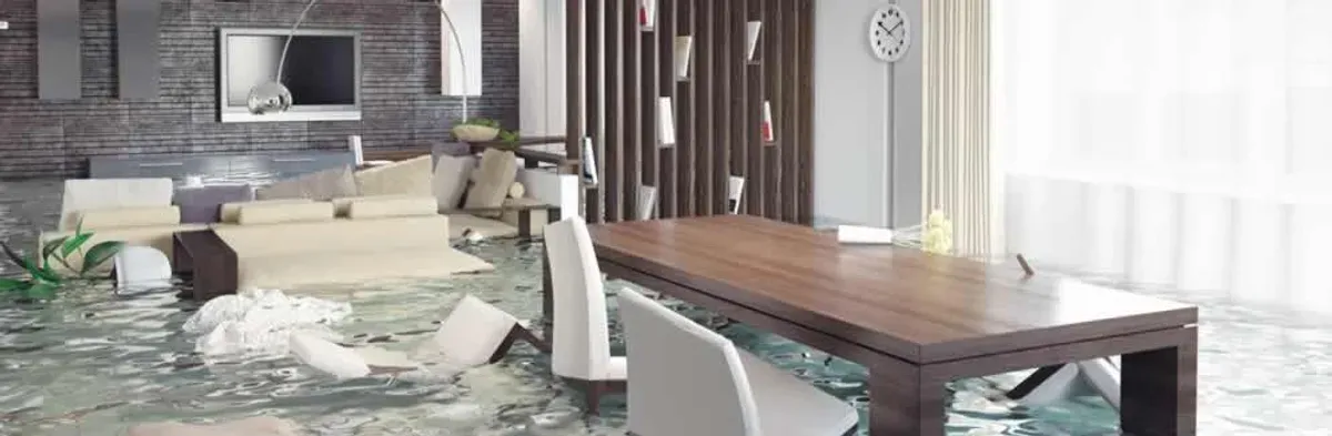 home interior affected by water damage with flooded floors and displaced furniture in Boston, MA